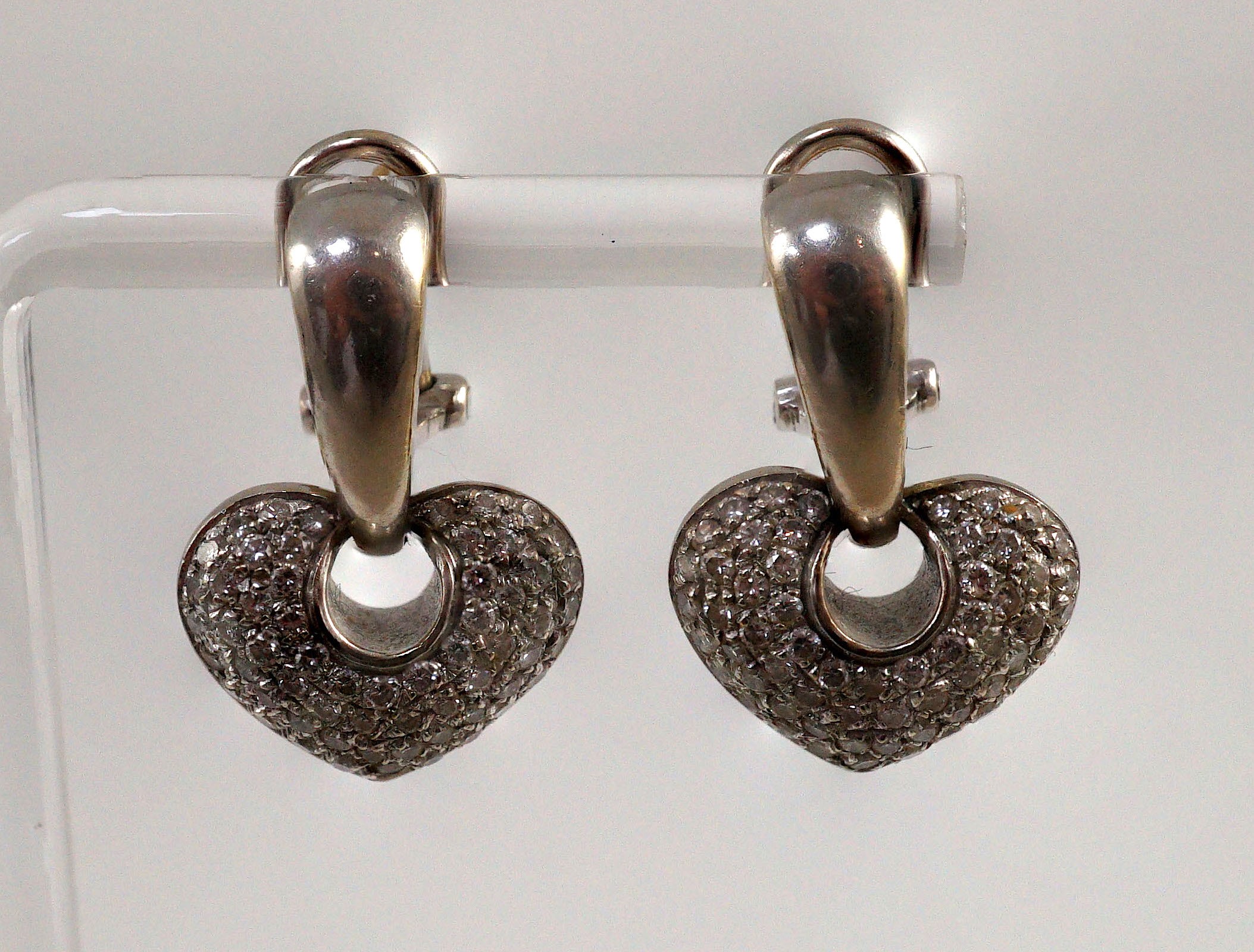 A modern pair of Italian 18ct white gold and pave set diamond heart shaped earrings, by Chimento